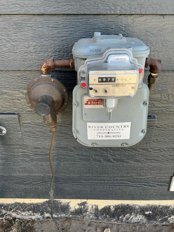 Responded to emergency service call for a 50-gallon Richmond power-vented water heater (natural gas/propane) that was not functioning. Diagnostic inspection revealed water leaking onto the burner assembly, preventing proper ignition. Provided customer with replacement options for both standard tank and tankless water heater systems.