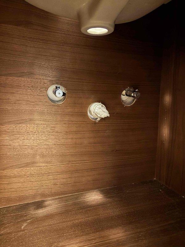Installed customer-provided vanity but was unable to complete full installation due to incompatible fixtures (single-hole vanity top with three-hole faucets). Partial payment collected for completed work. Will return to install faucets and drains once customer acquires compatible fixtures.
