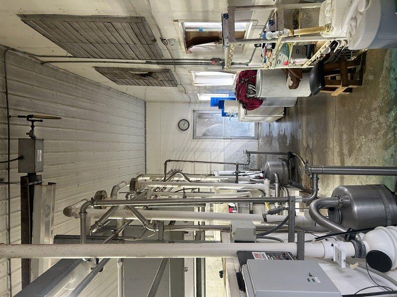 Responded to no-heat service call for LP tube heater in milking parlor. Diagnosed unit but was unable to complete service due to inadequate ladder access height for ceiling-mounted equipment. Service will be rescheduled with appropriate A-frame ladder to safely perform the necessary repairs.
