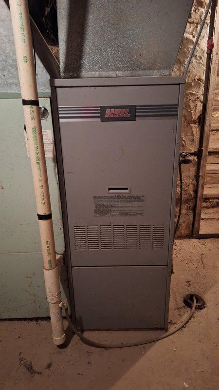 Responded to no heat complaint for aging natural gas furnace. Diagnosed blower motor locked up and failed thermostat. Performed comprehensive safety inspection with no immediate hazards found, replaced thermostat to restore basic functionality, and scheduled follow-up consultation for replacement options due to unit's overall deteriorated condition and age.