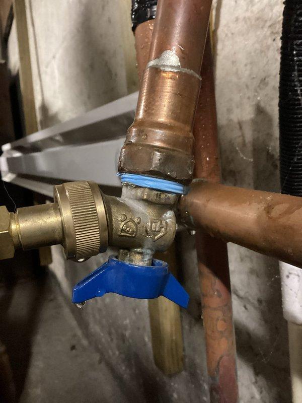 Diagnosed water leak at the connection point of boiler water bowl valve, as verified by customer video documentation. Applied new pipe tape to the valve connection, re-installed the component, and restored system to proper operating pressure. Unit now functioning correctly with no active leaks; customer advised to report any further issues.