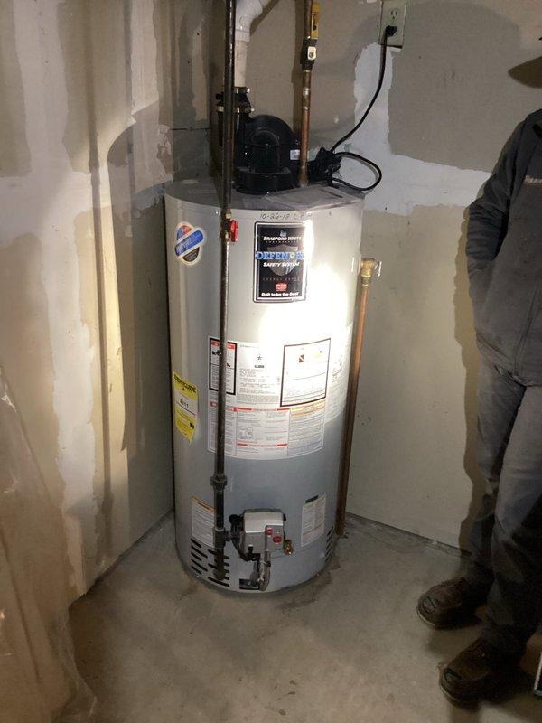 Responded to service call for water heater with no hot water output. Diagnosed issue as tripped circuit breaker. Restored power to unit by resetting breaker and verified proper operation of the tanked water heater system.