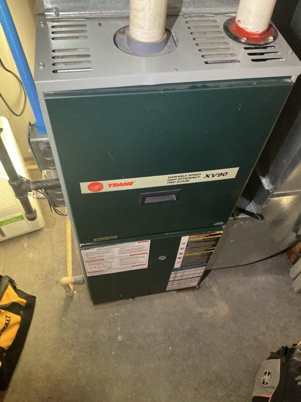 Diagnosed 24-year-old Trane XV80 high efficiency furnace with no heat issue. Identified multiple critical failures including cracked high limit switch, intermittently failing gas valve (required physical tapping to achieve ignition), and previously replaced heat exchanger showing signs of failure. Recommended complete replacement of heat exchanger and gas valve assembly due to advanced age of system and safety concerns.
