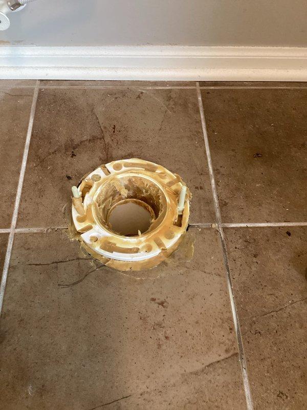 Responded to water leak complaint where water was penetrating through kitchen ceiling from upstairs bathroom. Diagnosis revealed an improperly installed toilet flange that was positioned too low. Removed toilet, built up the flange to proper height, and reset toilet which successfully resolved the leak issue.