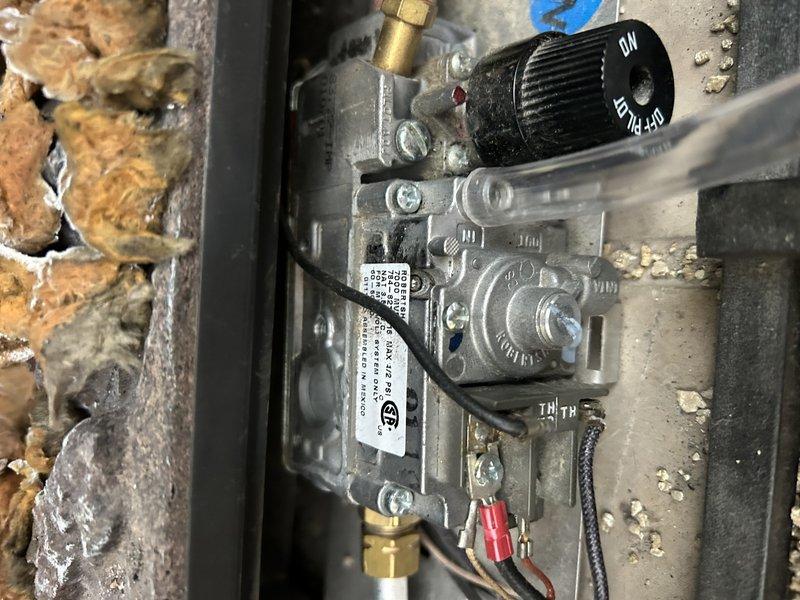 Responded to service call for CFL-24NG gas log fireplace experiencing intermittent operation issues. Diagnostic inspection revealed adequate supply pressure (above 5" WC) despite long gas line run through attic and basement. Identified delayed gas shutoff in pilot assembly after flame extinguishment as likely cause of operational problems. Recommended replacement of gas valve and pilot assembly to resolve intermittent operation.