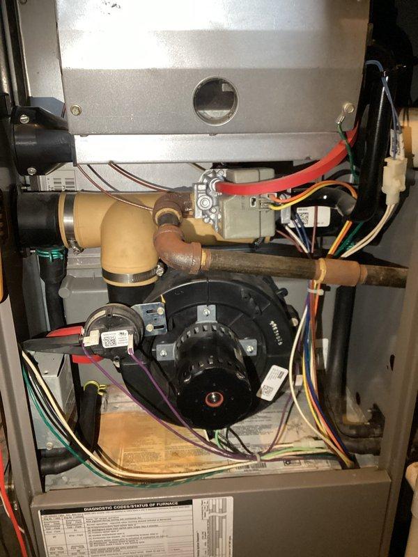 Responded to no-heat call on furnace approximately 10 years old. Upon inspection, found system overheating due to restricted airflow. Cleaned clogged air filter and verified proper operation of blower motor assembly and control board connections. System now functioning correctly with normal heat cycle and no unusual odors.