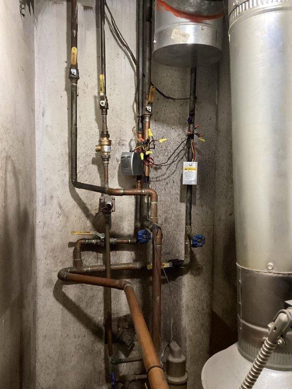Responded to no heat call for Weil-McLain LP boiler system. Diagnosed issue as interrupted gas supply to boiler causing pilot light outage. Re-lit pilot light, verified proper operation of both zone thermostats, and confirmed all components were functioning correctly. Provided homeowner with instructions on proper pilot light relighting procedure for future reference.