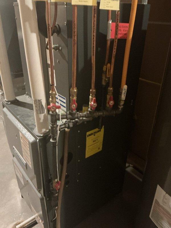 Conducted comprehensive plumbing inspection with special attention to main shut-off valve. Examined HVAC system with copper piping and control valves, plus bathroom shower installation with bronze fixtures. All plumbing systems were found to be in good working condition with no issues identified.