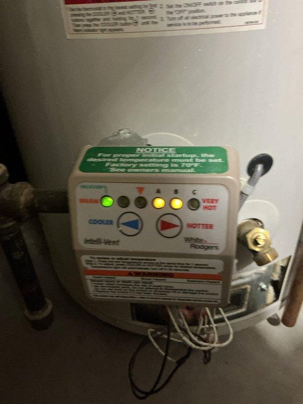 Responded to service call for non-functional water heater displaying diagnostic codes (green and yellow indicator lights). Diagnosed faulty control valve on Intelli-Vent system. Recommended replacement of valve assembly to restore proper heating function. Customer referred to comfort advisor for replacement options.