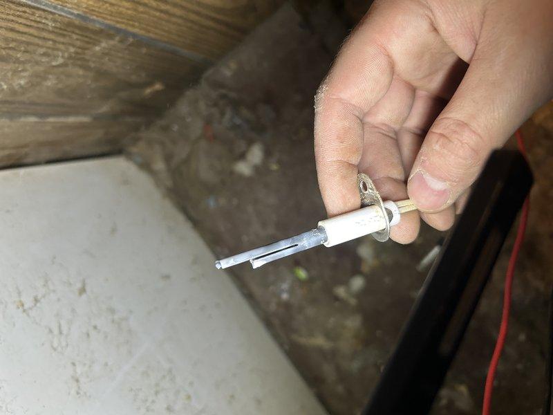 Diagnosed no heat complaint on aging natural gas furnace. Found failed igniter and damaged limit switch connection near blower. Replaced igniter, repaired electrical connections, and verified proper ignition sequence. Visual inspection of heat exchanger showed no issues, though blower assembly requires cleaning.
