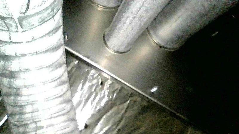 Diagnosed no heat complaint on aging natural gas furnace. Found failed igniter and damaged limit switch connection near blower. Replaced igniter, repaired electrical connections, and verified proper ignition sequence. Visual inspection of heat exchanger showed no issues, though blower assembly requires cleaning.