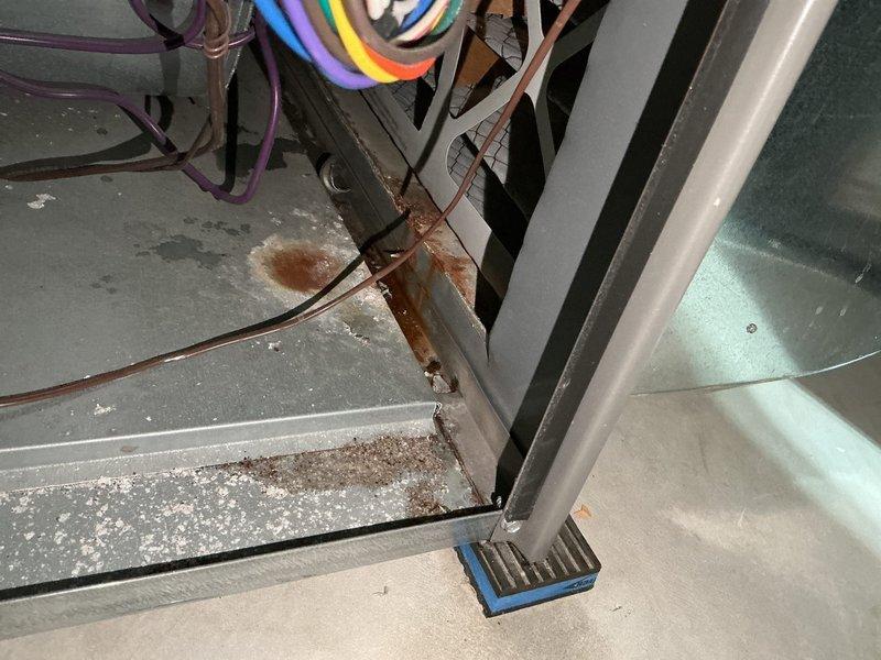 Diagnosed 7-year-old furnace with intermittent shutdown and water leakage issues, determining the cause to be a failing inducer draft motor and leaking collector box causing pressure switch to open. Confirmed safe CO levels in flue and good heat exchanger condition, submitted parts order for collector box/condensate trap and inducer draft motor, and provided temporary space heaters until repair can be completed upon parts arrival.