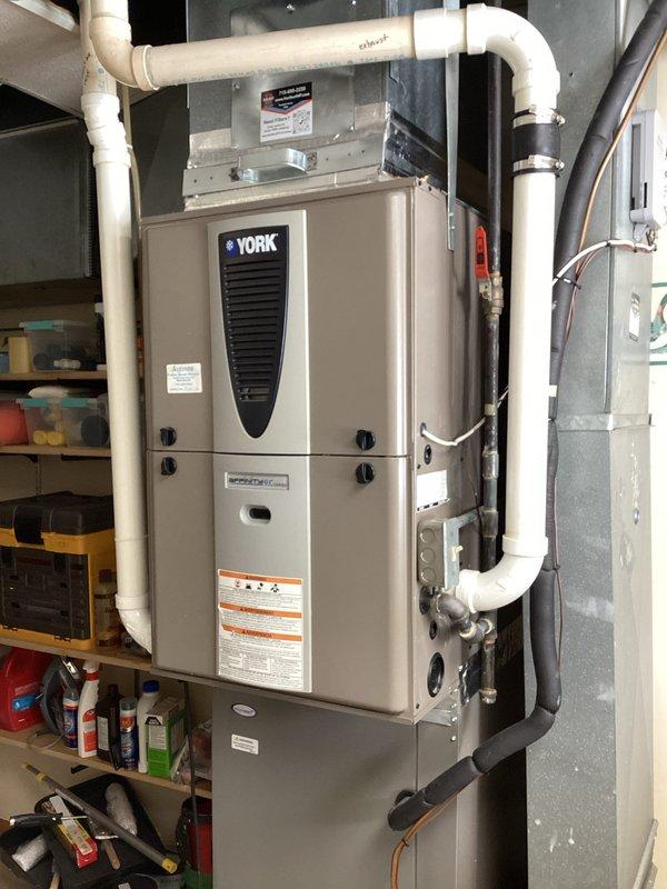 Diagnosed York LP furnace with intermittent operation where unit would attempt to fire but shut down shortly after flame ignition. Inspection revealed heavily corroded flame sensor with significant build-up, which was thoroughly cleaned. Performed comprehensive system check including verification of condensate trap drainage and heat exchanger inspection with no additional issues found. Upon reassembly and testing, furnace now operates normally with proper flame retention.