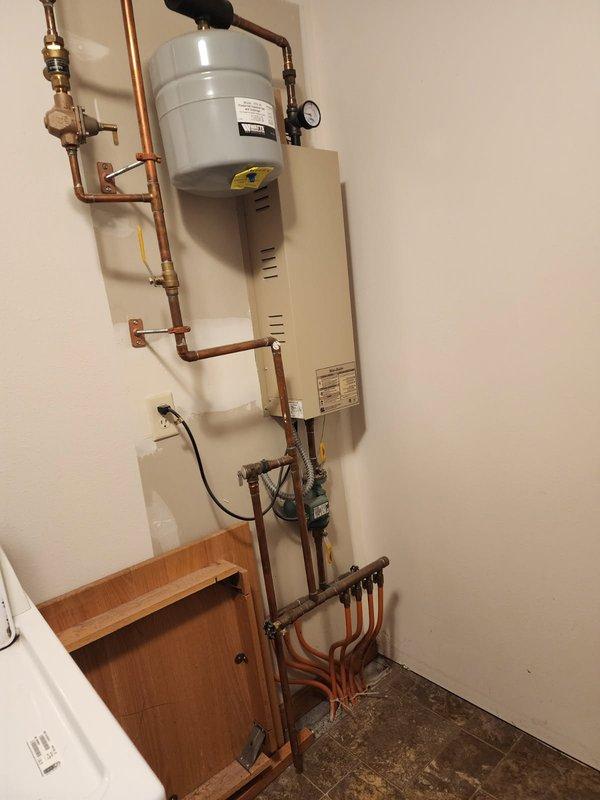 Completed routine maintenance flush on A.O. Smith ProMax 50-gallon electric water heater that was exhibiting leakage. Inspected and serviced the associated expansion tank, pressure gauge, and copper piping connections. Resolved leakage issue and ensured proper system operation with all components functioning according to manufacturer specifications.