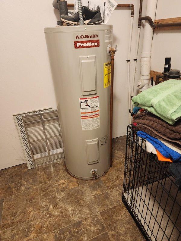 Completed routine maintenance flush on A.O. Smith ProMax 50-gallon electric water heater that was exhibiting leakage. Inspected and serviced the associated expansion tank, pressure gauge, and copper piping connections. Resolved leakage issue and ensured proper system operation with all components functioning according to manufacturer specifications.
