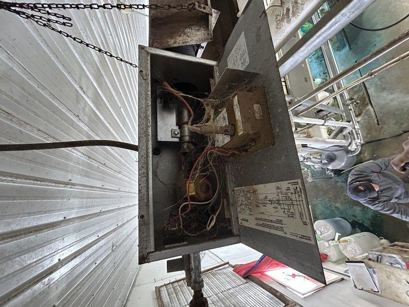 Responded to no heat complaint for hanging tube heater in barn. Diagnostic revealed failed exhaust draft motor with squirrel cage completely detached from shaft and deteriorating. Provided customer with options for exhaust motor replacement or complete system replacement; service advisor scheduled for follow-up consultation.
