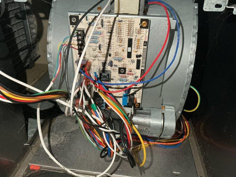 Responded to call for furnace not cycling on properly, resulting in intermittent heat. Diagnosed and cleaned dirty flame sensor, which restored proper operation with good micro amp readings. Noted two non-operational zone motor dampers with upstairs damper partially closed and unable to manually open, potentially causing furnace overheating; advised client that replacement or removal of dampers may be necessary if issue persists.