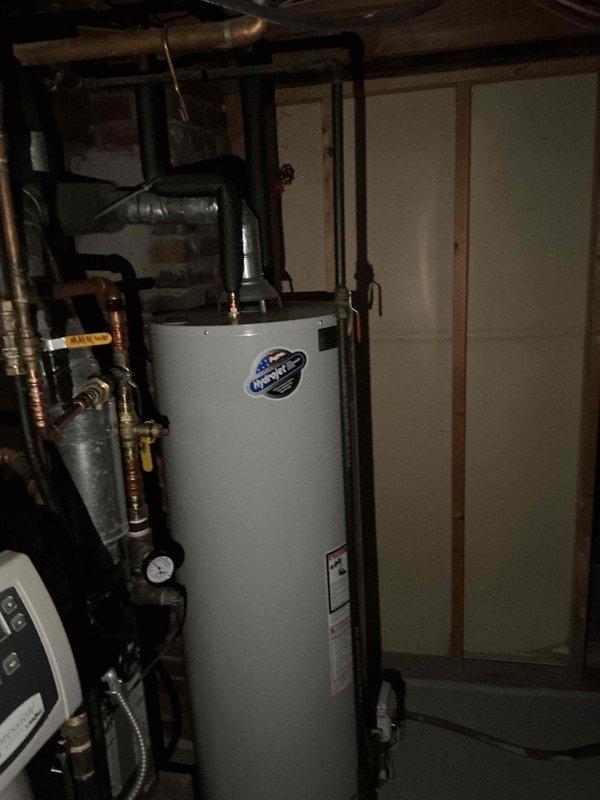 Disconnected electrical circuit from jetted tub as part of conversion to shower installation. Properly terminated wires in junction box and turned off breaker while maintaining circuit integrity for potential future use. Verified water heater and associated plumbing connections in utility room were in normal working condition with no visible issues.