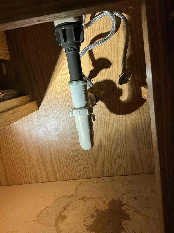 Diagnosed and repaired slow leak under upstairs bathroom sink by installing missing trap nut on drain assembly. Installed customer-supplied faucets in both upstairs and downstairs bathrooms, eliminating existing drip and restoring proper functionality to both fixtures.