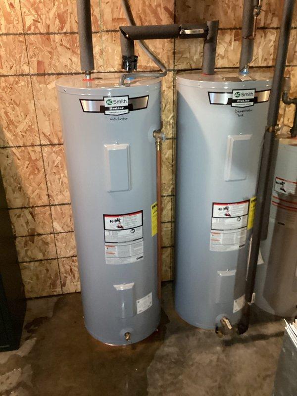 Performed inspection of leaking water heater system with two tanks. Documented existing A.O. Smith water heaters and associated plumbing infrastructure. Customer approved replacement of both the main water heater tank and the D super heater tank that feeds into it. Also noted intermittent water supply issues potentially related to well pump pressure switch that will need evaluation during replacement service.