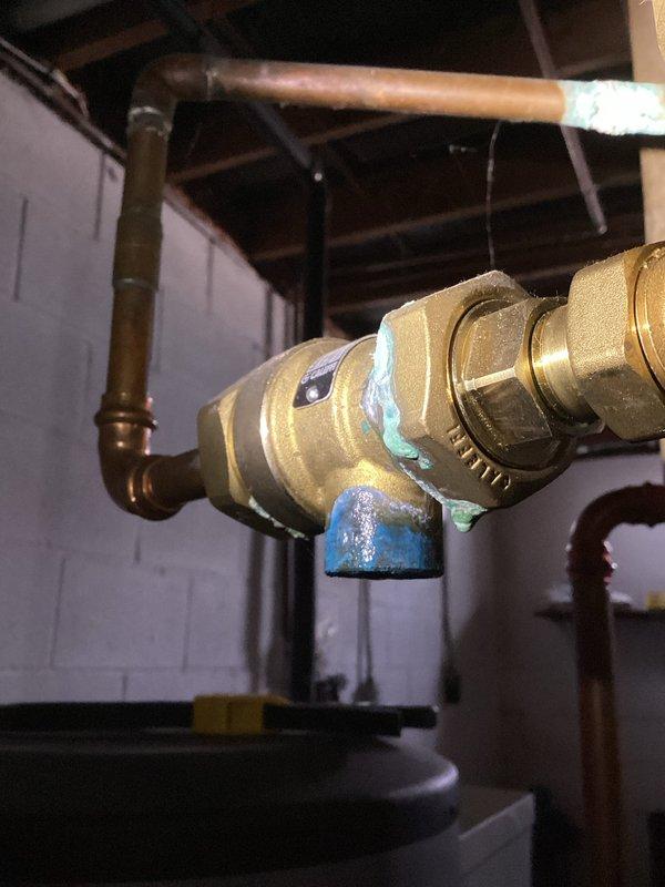 Performed annual boiler tune-up service including cleaning the flame sensor and flushing the condensate trap. Inspection revealed the heat exchanger is in acceptable condition and all boiler settings are properly configured. Discovered and documented a leaking backflow preventer relief valve, provided estimate for repair and initiated warranty investigation as unit was installed approximately two years ago.