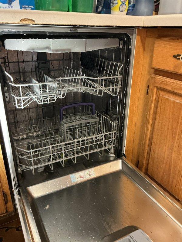 Responded to service call regarding dishwasher drainage issue. Inspected unit and connections, determining all plumbing connections were intact and functioning properly. Discovered internal leak in dishwasher catch pan unrelated to plumbing work; advised customer to contact appliance manufacturer for warranty service.