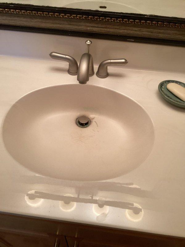 Conducted comprehensive plumbing inspection of bathroom fixtures, focusing on TOTO toilet and sink installation. Observed significant mineral buildup and staining in toilet tank components including float mechanism and flushing system. Sink examination revealed functional brushed nickel faucet with dual handles; minor staining noted around drain area.