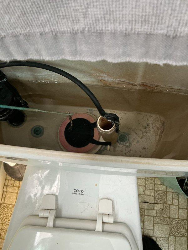 Conducted comprehensive plumbing inspection per annual service agreement. Identified defective water heater with melted top thermostat and replaced with new 50-gallon electric unit. Also documented toilet tank with mineral buildup and bathtub with significant rust staining around drain area, which may require future attention.
