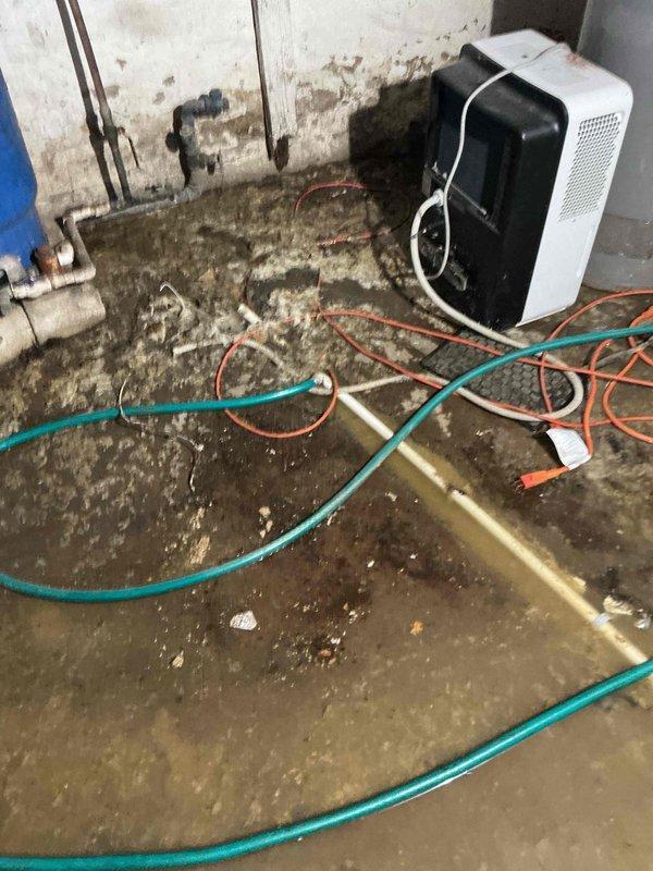 Responded to no heat call for furnace installed last year. Discovered significant basement flooding with sewage backup that compromised the system drain line. Vacuum-cleaned the drain line to restore proper drainage functionality and tested system operation after addressing the water damage.