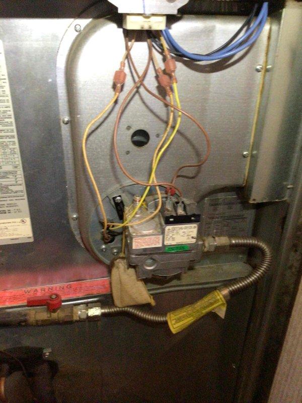 Performed diagnostic service on a 30-year-old Evcon direct vent forced air furnace (Model DGR105S8DD) that was experiencing short cycling and no air flow. Identified multiple issues including a cracked heat shield, though heat exchanger remained intact. Restored basic functionality and advised customer on replacement options through service advisor due to unit's advanced age and condition.