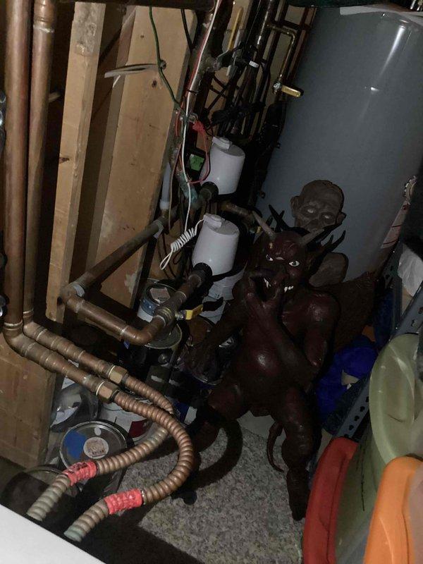 # Plumbing Inspection Service Report

Completed comprehensive plumbing system inspection of residential utility room. Inspection focused on water heater installation, distribution piping, and circulation equipment to assess overall system condition and identify any potential concerns.

## Primary Systems Inspected

**Water Heating System:** Examined residential water heater tank unit including all supply and discharge connections. Verified proper pipe connections at top of unit with copper and black piping configurations. Assessed tank exterior condition and manufacturer specifications visible on unit labeling.

**Plumbing Distribution Network:** Inspected vertical copper supply lines running along wall framing. Evaluated corrugated flexible copper connector lines with valve assemblies for proper installation and secure fittings. Checked all visible pipe runs throughout utility space for proper support and routing.

**Circulation Equipment:** Assessed pump assembly and associated valve