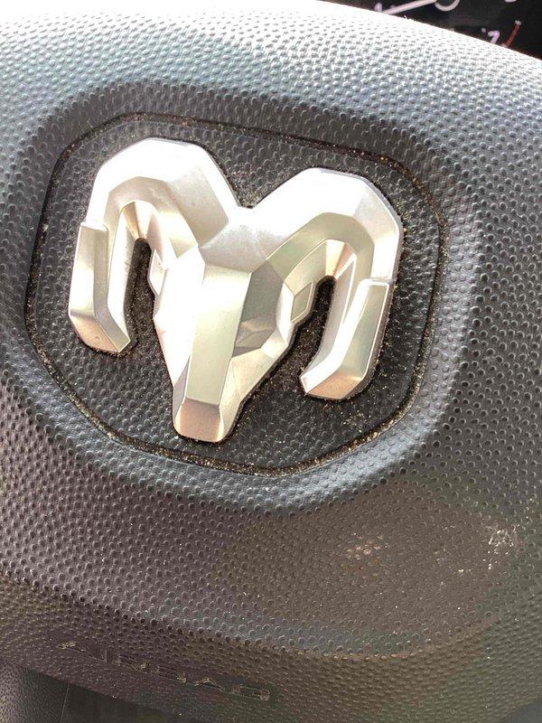 Completed warranty blower wheel replacement on HVAC unit. Initial installation attempt revealed scuttle opening was undersized for the replacement component, requiring careful maneuvering to position the bulky part onto the rooftop while protecting the new building structure. Ladder was properly secured and positioned to prevent any damage during the lift. After successful installation of the blower wheel assembly, performed operational testing which confirmed significantly reduced vibration levels, restoring unit to proper operating specifications.