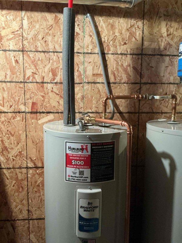 Successfully installed two 50-gallon Bradford White electric water heaters with complete copper piping connections and pressure relief valves. Addressed water pressure system issues by replacing a completely plugged pressure switch nipple, installing a new pressure gauge, cleaning the whole house filter, and adjusting air pressure in the expansion tank to proper levels.