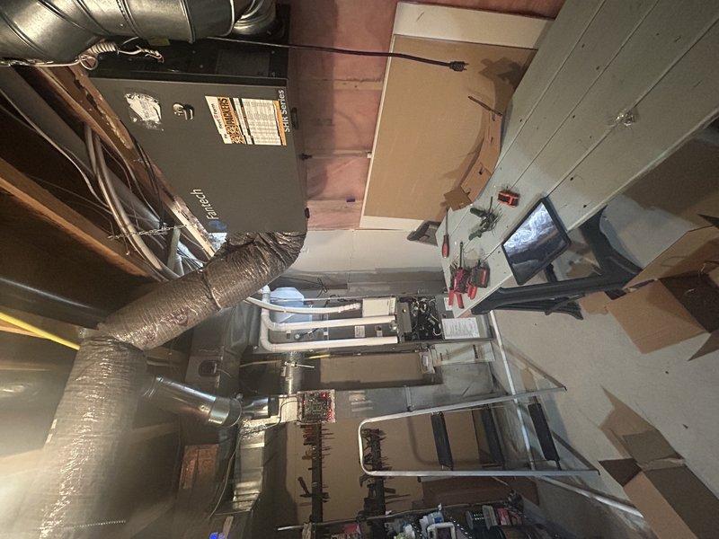 Replaced two zone dampers in a multi-zone HVAC system with a two-technician crew over four hours. The main floor zone damper required motor replacement only due to limited access preventing full assembly removal, while the second zone damper was completely replaced after removing obstructing ductwork. Both dampers were tested and verified to be operating correctly upon completion.