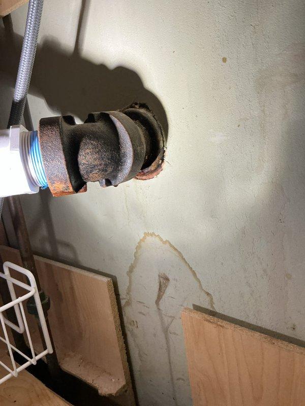 Responded to kitchen sink clog and leak beneath cabinet. Upon inspection, discovered severely corroded galvanized drain pipe with hole causing water damage to cabinet interior and wall. Removed deteriorated galvanized section and re-piped kitchen drain assembly using PVC materials to ensure proper drainage and eliminate leakage. Additionally, replaced malfunctioning bathroom tub spout that was missing the diverter component, restoring proper tub and shower operation. All plumbing connections tested and verified leak-free upon completion.
