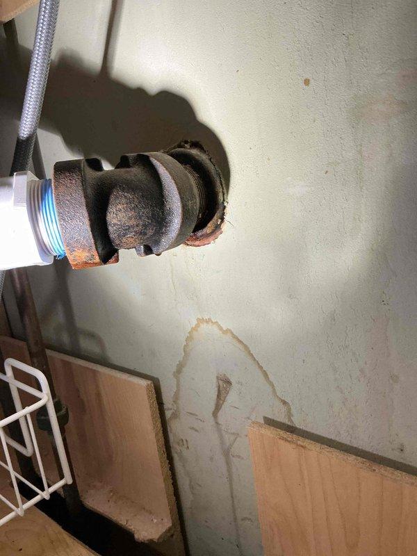 Responded to kitchen sink clog and leak beneath cabinet. Upon inspection, discovered severely corroded galvanized drain pipe with hole causing water damage to cabinet interior and wall. Removed deteriorated galvanized section and re-piped kitchen drain assembly using PVC materials to ensure proper drainage and eliminate leakage. Additionally, replaced malfunctioning bathroom tub spout that was missing the diverter component, restoring proper tub and shower operation. All plumbing connections tested and verified leak-free upon completion.