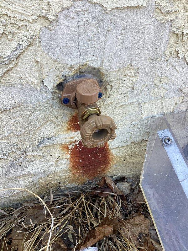 Responded to a frozen and broken outdoor hose bibb that failed during winter weather. Removed the damaged fixture and installed a new hose bibb assembly with proper mounting hardware. Additionally installed a drain valve as requested to allow for winterization and prevent future freeze damage.