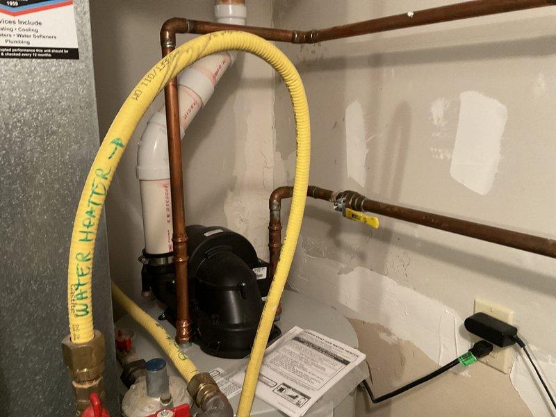 Completed comprehensive plumbing inspection as part of family rewards program. Measured water pressure at 96 PSI, which exceeds recommended residential levels of 40-80 PSI. Documented existing plumbing system including Bradford White water heater (installed 8-30-23), copper supply lines, corrugated gas line connections, and hydronic heating components with circulation pump. Provided estimate for pressure reducing valve installation to protect fixtures and appliances from excessive water pressure damage.