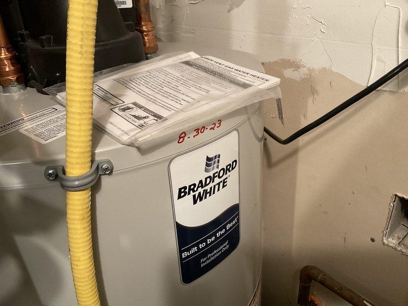 Completed comprehensive plumbing inspection as part of family rewards program. Measured water pressure at 96 PSI, which exceeds recommended residential levels of 40-80 PSI. Documented existing plumbing system including Bradford White water heater (installed 8-30-23), copper supply lines, corrugated gas line connections, and hydronic heating components with circulation pump. Provided estimate for pressure reducing valve installation to protect fixtures and appliances from excessive water pressure damage.