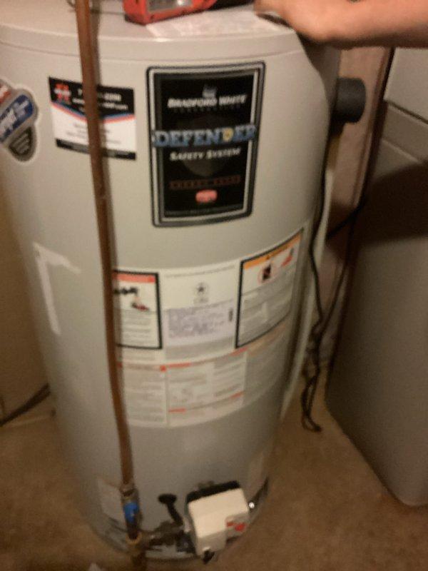 Responded to no hot water complaint on natural gas Defender water heater. Upon arrival, unit was not firing. Performed manual reset of system and successfully restored ignition. Cycled the water heater through multiple reset operations to verify consistent performance and proper flame characteristics. Unit fired reliably on each test cycle with good flame pattern observed. Confirmed hot water production restored and system operating within normal parameters.