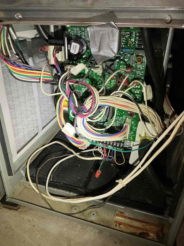 Responded to no-heat call on 15-year-old Trane furnace with reported humming noise from blower motor. Upon inspection, discovered heavily restricted MERV 12 air filter causing excessive static pressure, which forced the blower to ramp to high speed and created humming noise in ductwork. Replaced filter and confirmed noise elimination. 

Performed comprehensive system diagnostic including heat exchanger inspection using camera scope. Inspection revealed significant crack in heat exchanger located above factory crimp on lower burner cup section. Due to the critical safety hazard posed by potential carbon monoxide leakage into conditioned space, performed immediate safety lockout of equipment per industry protocol.

Documented findings with photographs of internal components including blower assembly, gas valve, control boards, and wiring configuration. Reviewed all available options with homeowner including repair versus replacement considerations. Completed manufacturer warranty researc