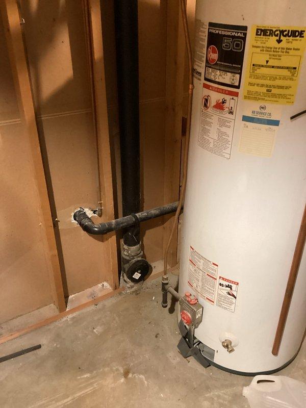 Responded to a main drain backup issue with secondary drainage problems affecting the kitchen sink and floor drain. Upon arrival, accessed the property through the garage and located the clogged floor drain in the basement utility area. Deployed cable equipment to clear the main line obstruction, which was determined to be caused by scale buildup within the drainage system. Successfully cleared the blockage and restored proper flow to both the main drain line and kitchen sink drain. Documented the water heater and electrical panel locations in the mechanical room for service records.