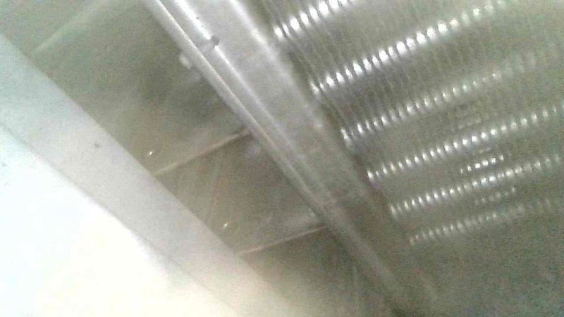 Completed comprehensive furnace tune-up on residential heating system. Heat exchanger inspected and found to be in acceptable operating condition. Identified failed inducer motor assembly with cracked wheel on backside requiring replacement. Documented unit make, model, and serial number information with photographs. Provided estimate for inducer motor replacement; customer will advise on authorization to proceed with repair.