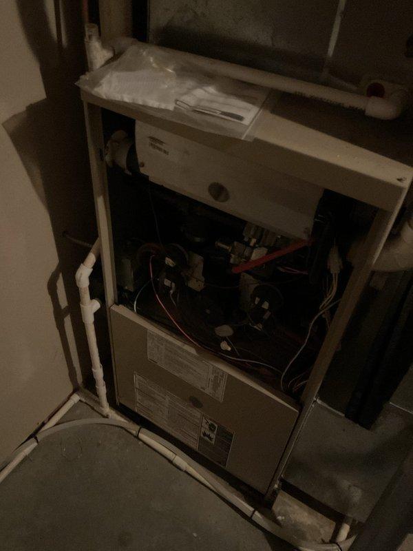 Completed comprehensive furnace tune-up on residential heating system. Heat exchanger inspected and found to be in acceptable operating condition. Identified failed inducer motor assembly with cracked wheel on backside requiring replacement. Documented unit make, model, and serial number information with photographs. Provided estimate for inducer motor replacement; customer will advise on authorization to proceed with repair.