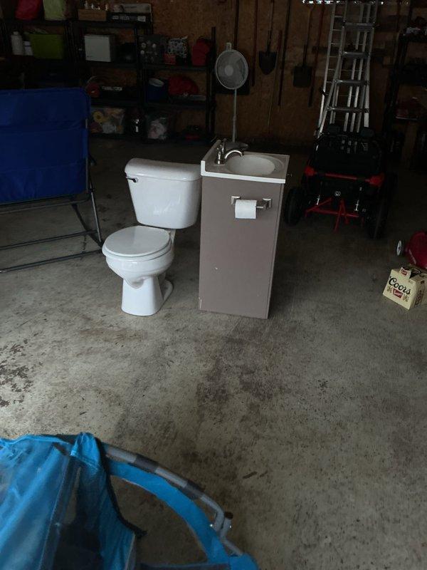 Removed and relocated existing toilet and vanity sink to garage in preparation for flooring replacement by another contractor. Disconnected water supply lines and drain connections for both fixtures, ensuring proper shutoff and no water damage. Additionally, diagnosed and repaired a leaking tub drain assembly that was discovered during the service visit. All removed fixtures were staged in the garage for potential reinstallation or disposal per customer request.