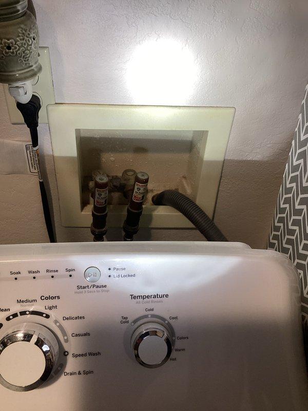 Completed comprehensive plumbing inspection of residential property including laundry area and water heater installation. Inspected washing machine water supply connections, shut-off valves, and flexible hoses in laundry room; verified Bradford White water heater installation with copper piping configuration, ball valve operation, and proper venting system. All plumbing components, connections, and fixtures were documented photographically and found to be in serviceable condition.