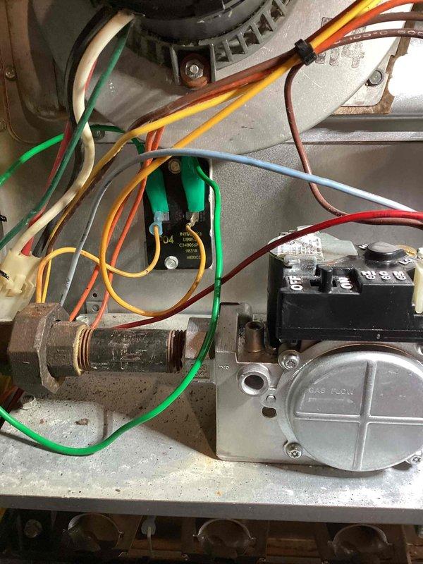 Responded to no heat call on Trane XL 80 furnace with blower operating but no ignition. Diagnosed faulty high limit switch stuck in open position, preventing burner operation despite receiving 24V control voltage. Replaced defective high limit switch and verified proper system operation with all safety controls functioning correctly.