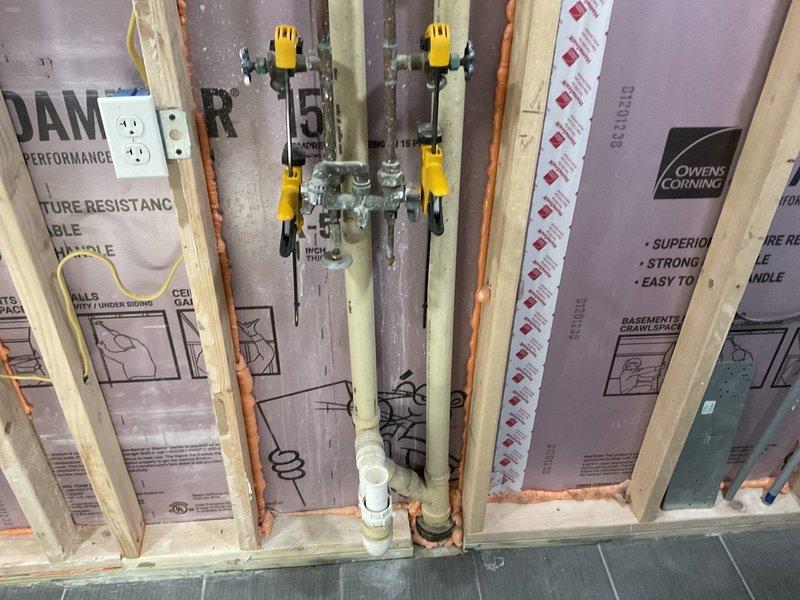 Provided comprehensive plumbing estimate for lower level laundry room installation, including rough-in specifications for waste line, two sets of hot and cold water supply lines with laundry hookup inserts, and gas line addition for range appliance. Assessed existing framing and insulation configuration to determine optimal routing for copper supply piping through wall cavities and proper waste line placement. Customer requested work to be scheduled for the following week upon estimate approval.