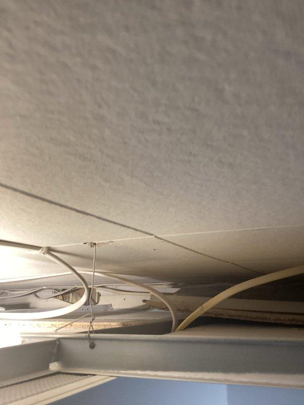 Responded to reported bathtub leak from upstairs fixture. Upon inspection, unable to reproduce active dripping or water flow from the tub area. Identified visible gap around the tub spout connection point. Applied continuous bead of silicone sealant around tub spout perimeter to seal gap and prevent potential water intrusion.