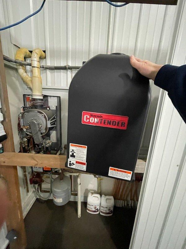 Responded to no heat call for gas boiler system located in barn/garage structure. Upon arrival, diagnosed boiler as non-operational due to low water condition. Filled system to proper operating level and verified all connections. Successfully restarted boiler unit, confirmed ignition sequence, and verified system returned to normal heating operation with proper circulation.